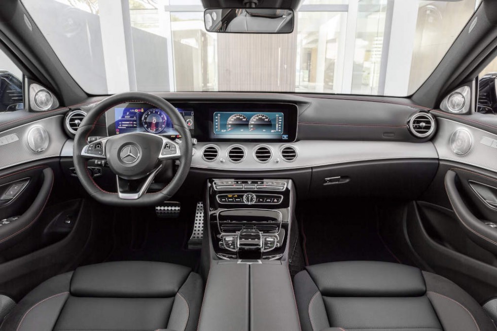 The interior reinforces the dynamic calibre of the new E 43 4MATIC with numerous individual details. The driver and front passenger find a secure position in the sports seats even when driving at speed, thanks to the improved lateral support. The upholstery in ARTICO man-made leather/DINAMICA microfibre in black (optionally: nappa leather) features a distinctive layout and red topstitching. To match the seat design, the door centre panels and the dashboard are finished in ARTICO man-made leather with red topstitching. Exclusive pedals, a black roof lining and red seat belts add further sporty highlights.