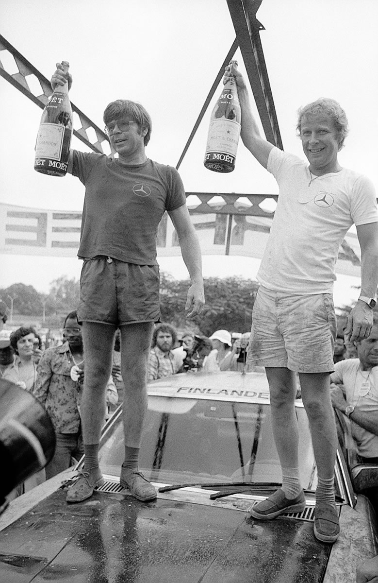 Hannu Mikkola (right) and Arne Hertz after their victory in the 11th Bandama Rally in 1979 with a Mercedes-Benz 450 SLC 5.0 rally car.