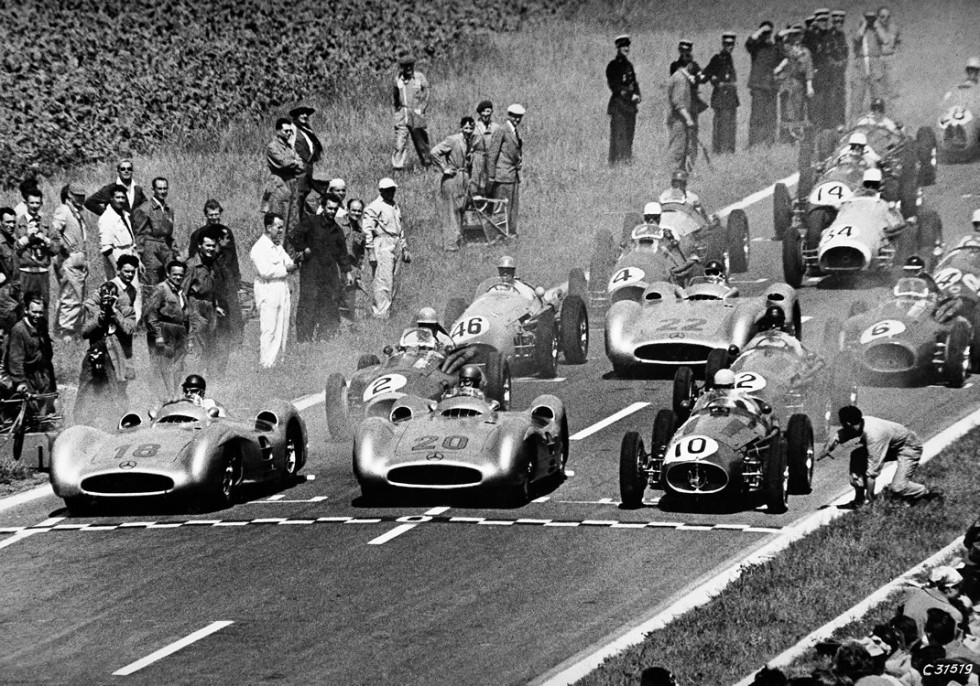 French Grand Prix in Reims, July 4, 1954. At the wheel of streamlined Mercedes-Benz W 196 R racing cars: Juan Manuel Fangio (start number 18), the winner of the race, and Karl Kling (start number 20) who finished in second place. Behind them Hans Herrmann with start number 22.
