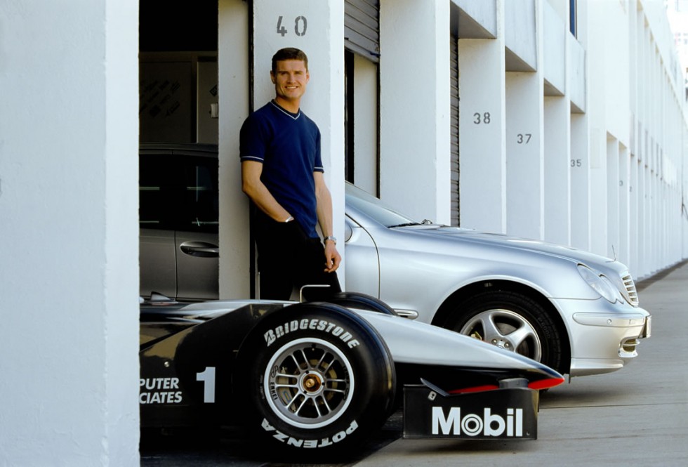 David Coulthard, former Formula One racing driver on McLaren-Mercedes, with McLaren-Mercedes MP4-15 and Mercedes-Benz C 320 (203 series). Photo from 2000.